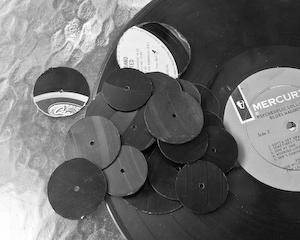 Pendants cut from vinyl record albums