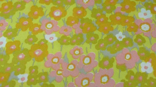 Vintage floral fabric in yellows, pinks, and greens.