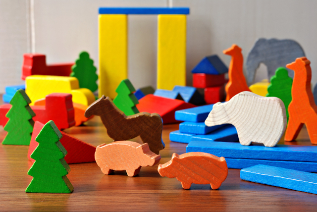 painted wooden toys image via Shutterstock