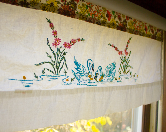 roller shade repaired with stash fabric and a vintage pillowcase
