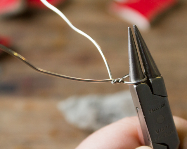 Use needlenose pliers to put a hanging loop into the wire before you wrap your object.