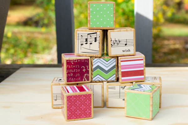 Ways to Embellish Wood: Decoupage alphabet blocks that your kids no longer play with to give them a new life. They make excellent holiday decorations!