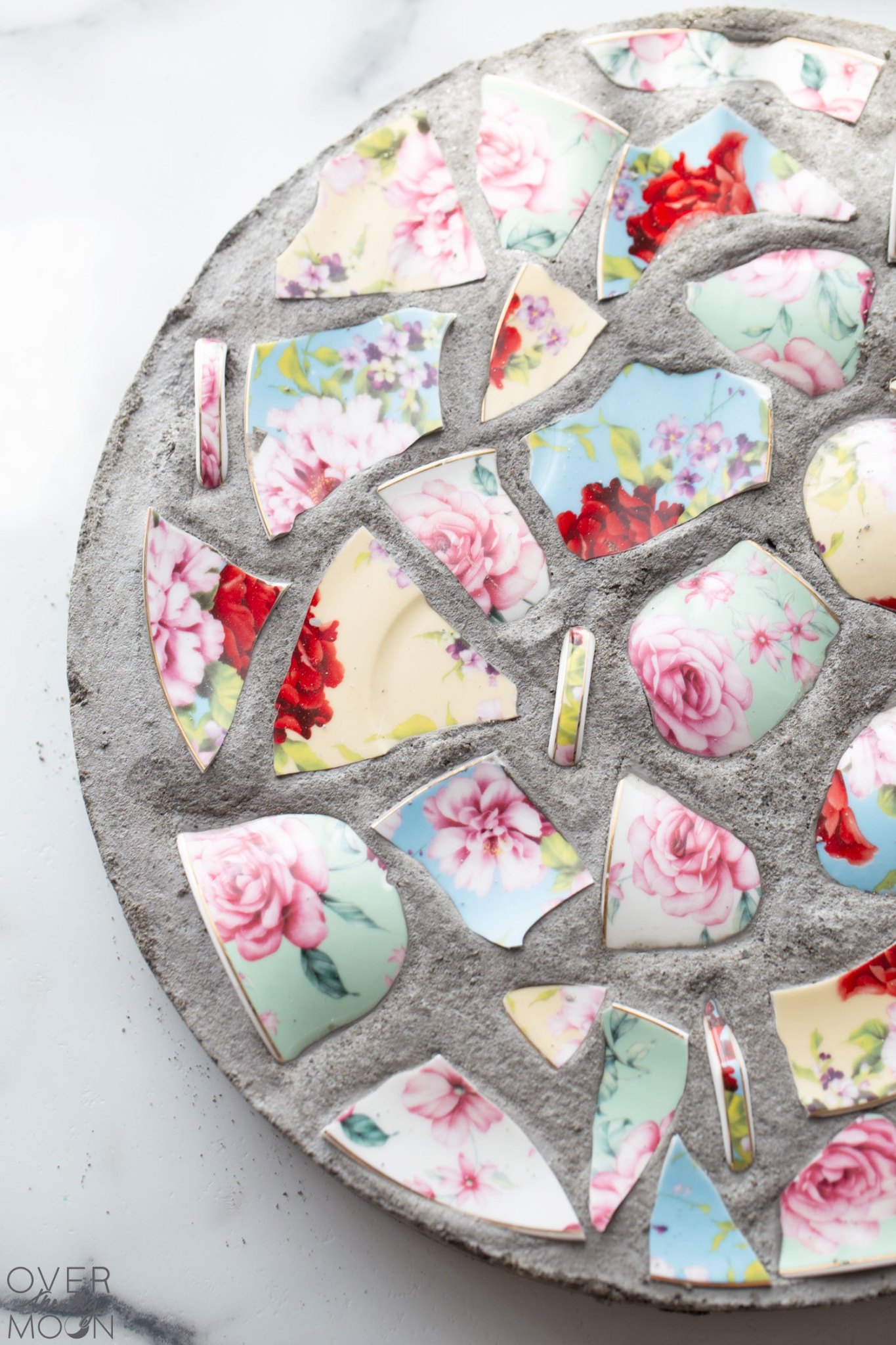ways to upcycle broken dishes to stepping stones
